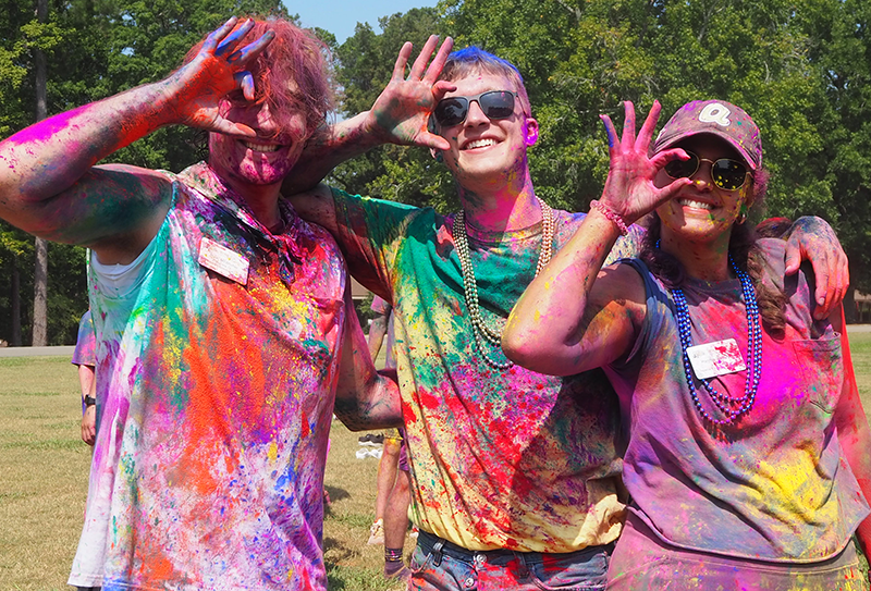 Three Wreck campers painted in bright colors.